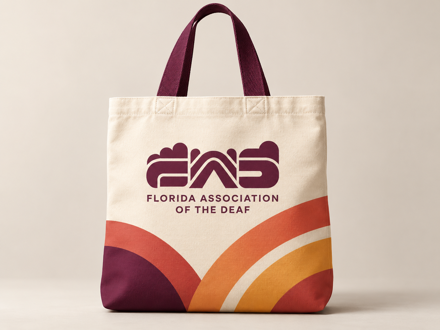 A canvas tote bag with the Sunrise wordmark in dark ink, carried on a Florida street.